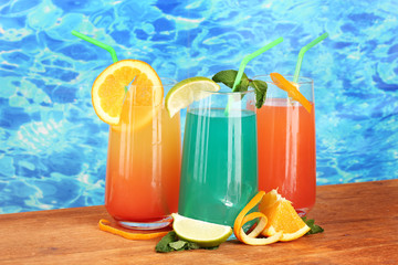 Three coctails on blue background