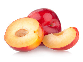 red plums isolated on white