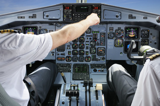 Fototapeta Pilots in the plane cockpit