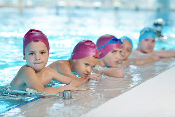 happy children group  at swimming pool