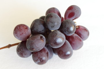 Purple grape isolated on black background