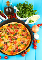 colorful composition of delicious pizza, vegetables and spices