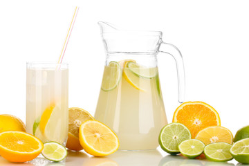 Citrus lemonade in pitcher and glass of citrus around isolated