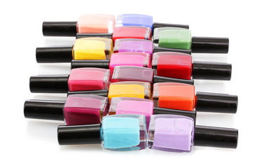 Group of bright nail polishes isolated on white