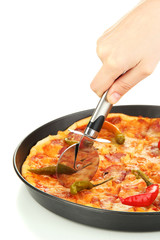 cutting tasty pepperoni pizza in pan isolated on white
