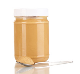 Delicious peanut butter in jar isolated on white
