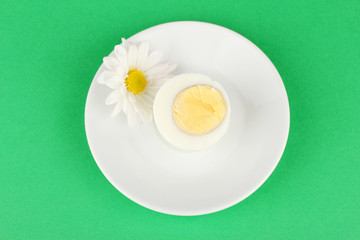 Boiled egg on color background