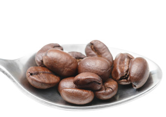 metal spoon with coffee beans