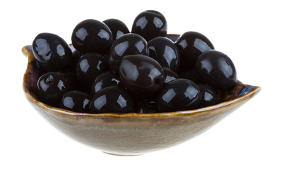 Olives black watered with olive oil in a bowl isolated on a whit