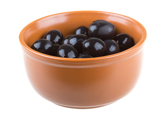 Olives black watered with olive oil in a bowl isolated on a whit