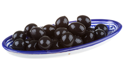 Olives black watered with olive oil in a bowl isolated on a whit