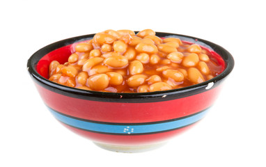 Marinated haricot beans in tomato sauce with shallots on a plate