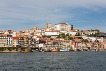 Fototapeta premium View of Porto city at the riverbank (Ribeira quarter) and wine b