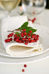 Place setting with red berries