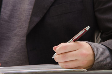 Businessman signing a document