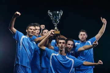 soccer players celebrating victory