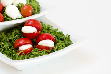 tomato, green slad, oil and italian mozzarella