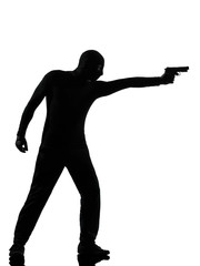 thief criminal terrorist aiming gun man