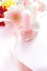 close up of pink gerbera and nails 