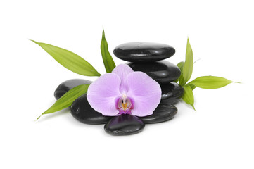 Black stones and bamboo leaf with orchid