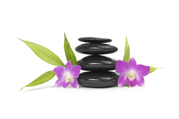 Fototapeta na wymiar zen stones with two orchid and bamboo leaf, isolated