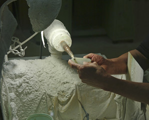 hands engraving stone