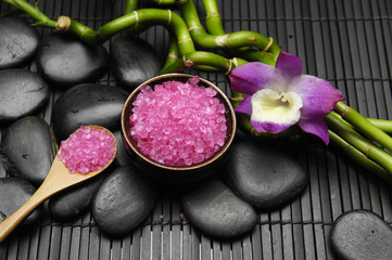 sea salt in bowl ,pink orchid, with zen stone and bamboo grove