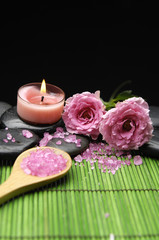 Fototapeta na wymiar Pink rose and zen stones with herbal salt in spoon