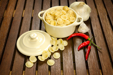 Uncooked pasta in a bowl