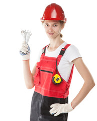 Construction worker in uniform with tools isolated on white