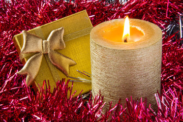 Gold candle with gift