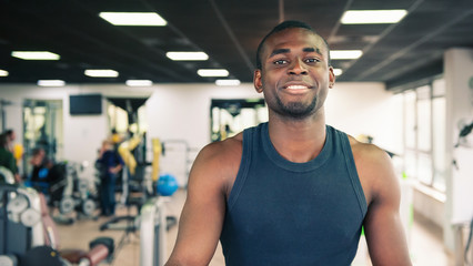 Young black man portrait in the gym.