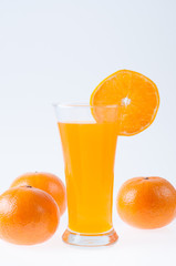 Orange juice and slices of orange  on white background