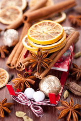Fototapeta na wymiar Christmas spices: star anise, cinnamon, cardamom and oranges
