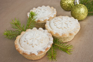 Christmas short crust pastry mince pies on golden tablecloth