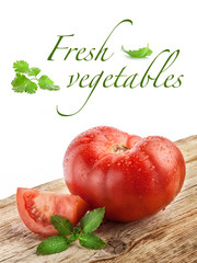 Tomatoes on grunge wooden background