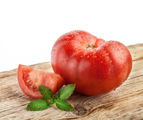 Tomatoes on grunge wooden background
