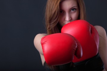 young woman with boxing gloves