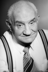 Senior vintage man wearing striped braces. Black and white.