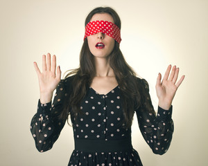 Portrait of the young woman blindfold.