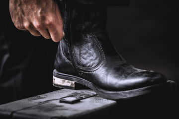 leather boots on valise