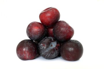 Stack of red plums
