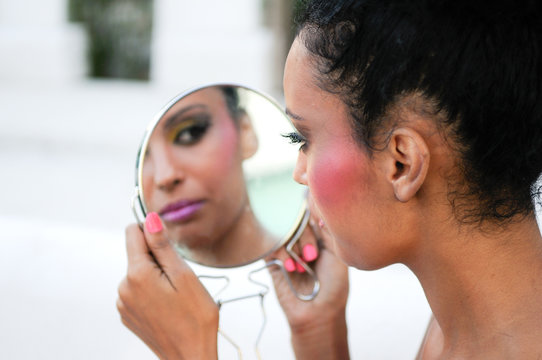 Beautiful black girl with mirror