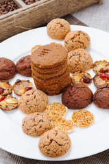 many different types of cookies lay on a plate