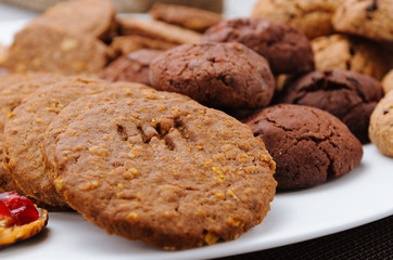 many different types of cookies lay on a plate