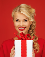 lovely woman in red dress with present