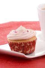 Festive cupcake with tea on fancy plate