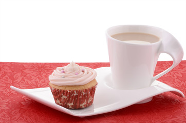 Festive cupcake with tea on fancy plate