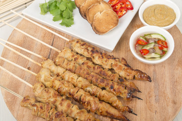 Moo Satay - Thai pork satay with peanut sauce, ajat & toast.