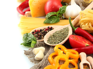 Pasta spaghetti, vegetables and spices, isolated on white